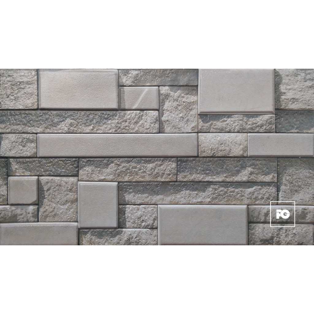 Fachaleta tipo piedra 30x60-gris-foncer-plomeria garcia-ok | Plomería García Gray stone wall with rectangular, textured blocks arranged in a staggered pattern