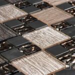 Close-up of square chocolate bars arranged in a grid with glossy melted centers.