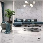 Piso ceramico color blanco-59x119-pulido-interior-laurenstone-lamosa-plomeriagarcia-2-ok | Plomería García Modern living room with white marble walls and floor, a teal sectional, gray chair, large plant, and circular coffee tables.