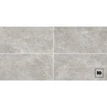 Piso ceramico gres color grey-60x120-mate-interior-exterior-amsterdam-castel-3-ok | Plomería García Four light-gray stone tiles arranged in a 2x2 grid with a small black pg logo in the bottom-right square.